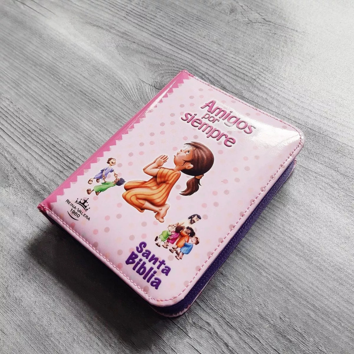 Biblia Reina Valera 1960 con cierre color rosa/fucsia "Amigos"